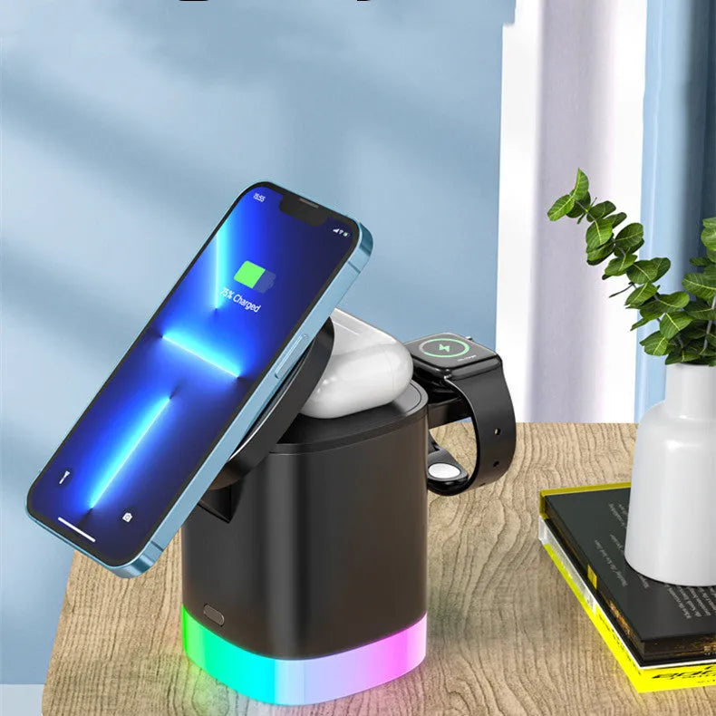 Black foldable 3 in 1 wireless charging station showing phone, watch, and earbuds charging simultaneously with RGB light