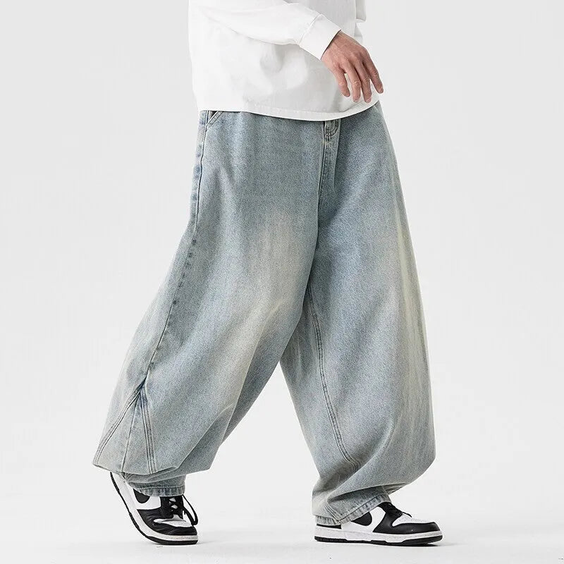 Men's plus size wide leg jeans in denim fabric with straight leg openings and low waist design