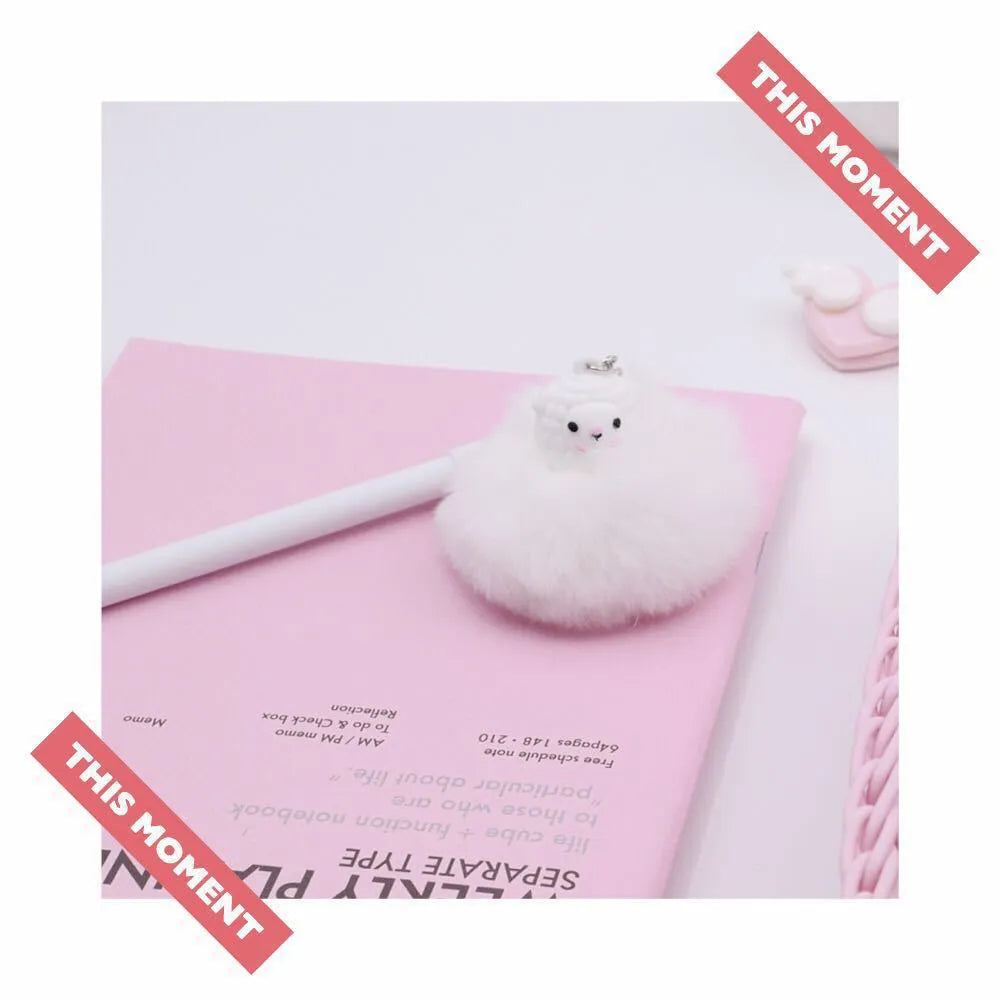 Plastic ballpoint pen with alpaca hair ball pendant, length 17cm, 0.5mm tip.
