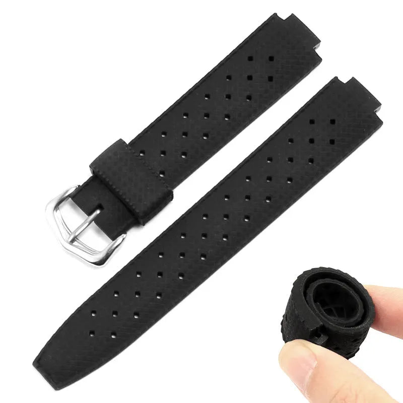 Black silicone watch strap with raised mouth and silver pin buckle on a smart watch