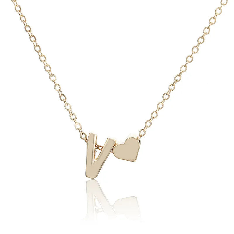 Peach heart shaped letter necklace pendant in gold or silver alloy.