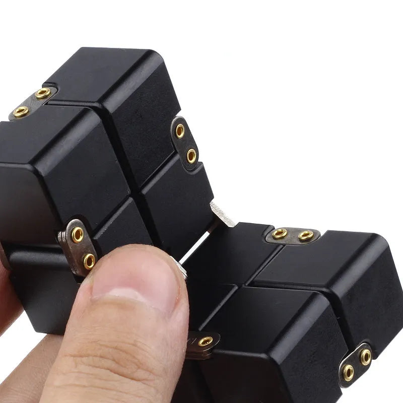 Zinc alloy infinity cube fidget toy in black or silver, showing rotating cubes on a 4cm scale.