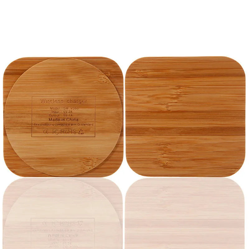 Brown heart-shaped wooden bamboo 5W Qi wireless charging pad on a desk