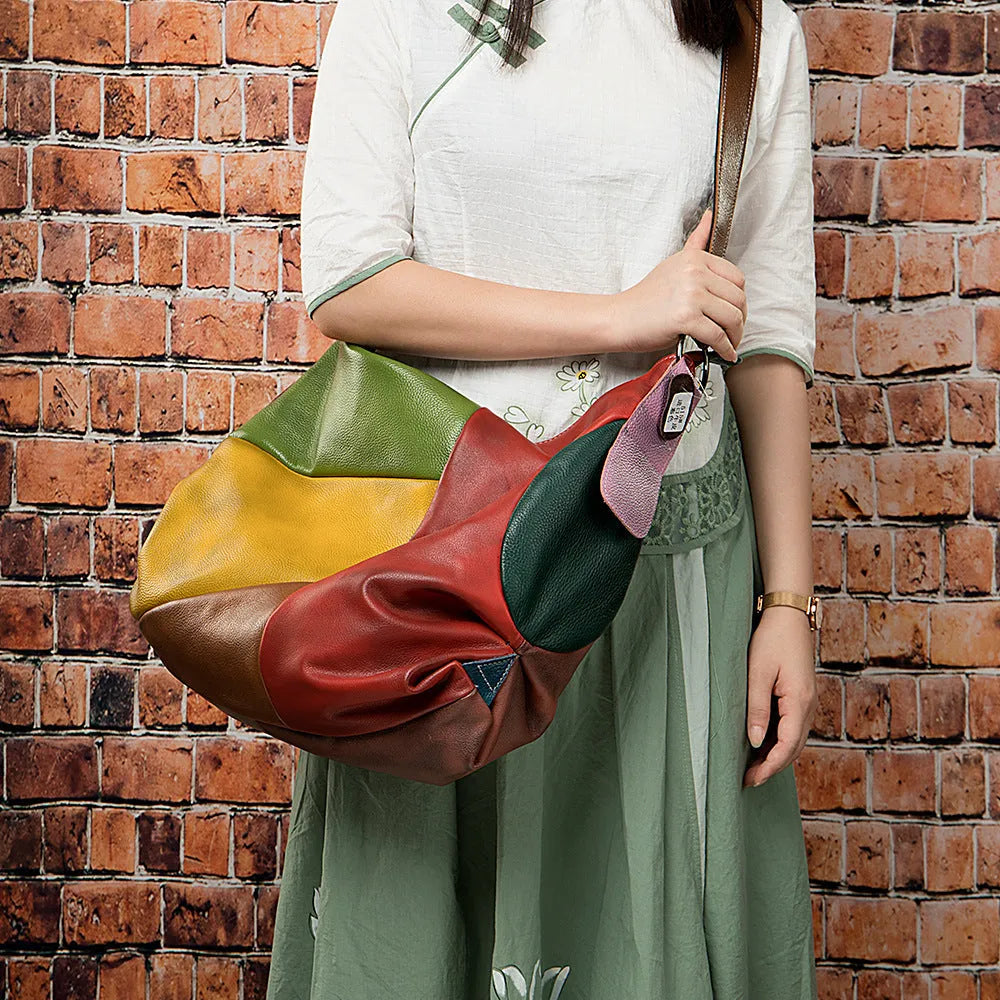 Cowhide leather travel shoulder bag in picture colour, shown with dimensions for laptop and A4 document carry.