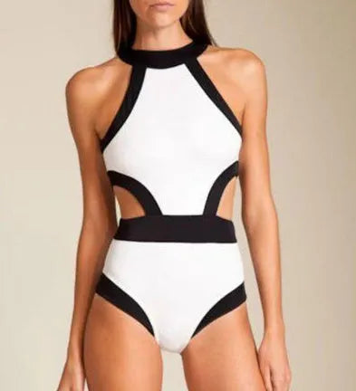 Women's one piece swimsuit in black and white patchwork design