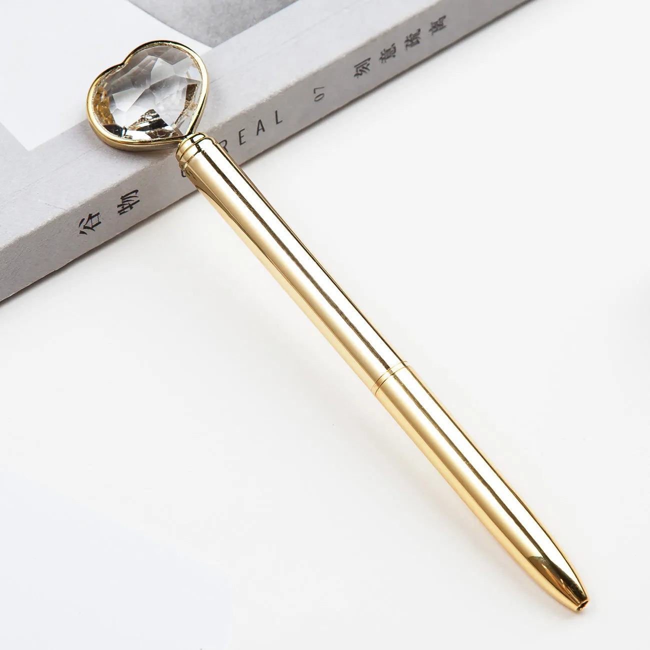 Creative Crystal Love Ball Diamond Metal Pen in gold, rose gold, and silver colours.