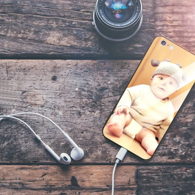 Patterned ultra-thin iPhone case with raised edges protecting the screen and camera lens.