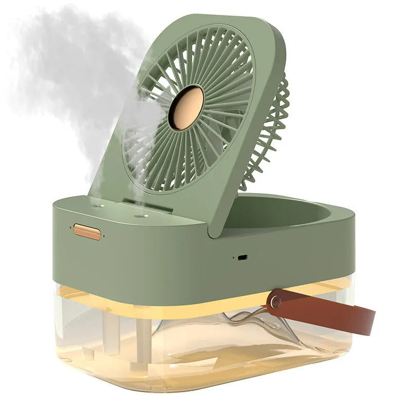 Pearl white USB desktop humidifier mist fan with water tank, remote control, and night light on a wooden desk.