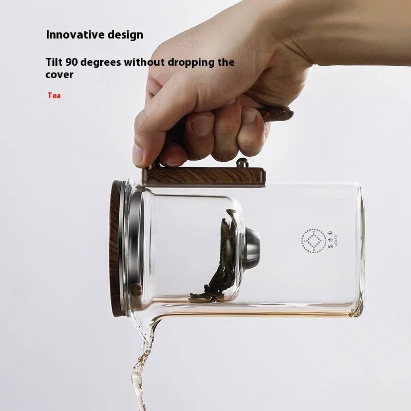 Innovative glass teapot with magnetic separation technology, wooden handle, and clear design for brewing and serving tea