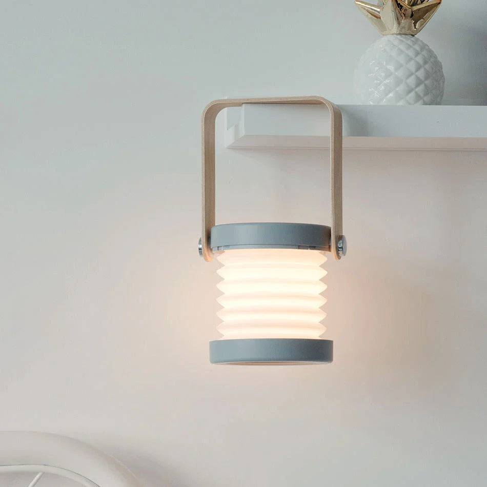 A foldable LED lamp with touch-sensitive dimming control, rechargeable battery, and a versatile design for home decor.