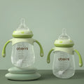 Wide caliber anti-colic baby bottle with handles in blue, green or red colours
