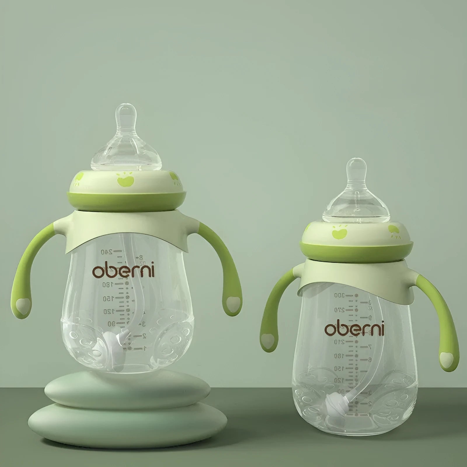 Wide caliber anti-colic baby bottle with handles in blue, green or red colours