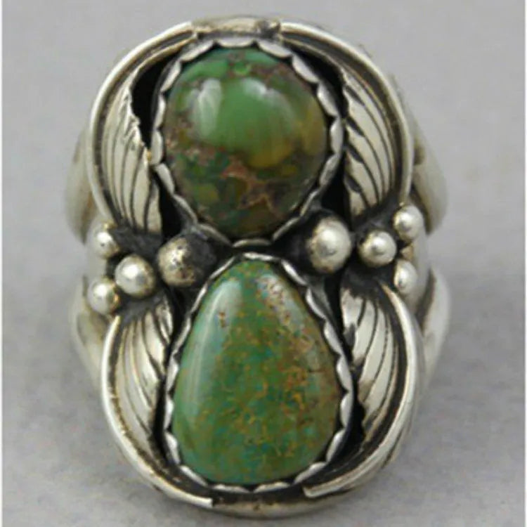 Turquoise geometric retro-style alloy ring for women on a ring stand.