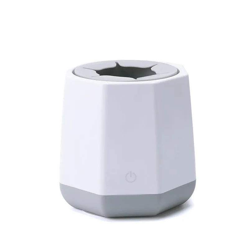White baby electric milk shaker with green silicone slot holding a round baby bottle, 110x110x110mm
