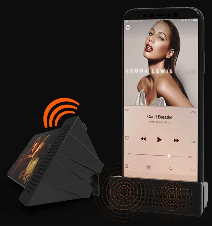 Mini black ABS plastic mobile phone amplifier bracket holding an iPhone on a desktop.