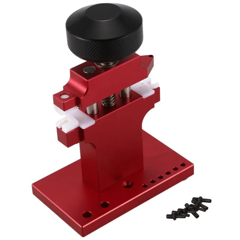 Red metal watch tube machine with 7 pusher punch bits in a stand
