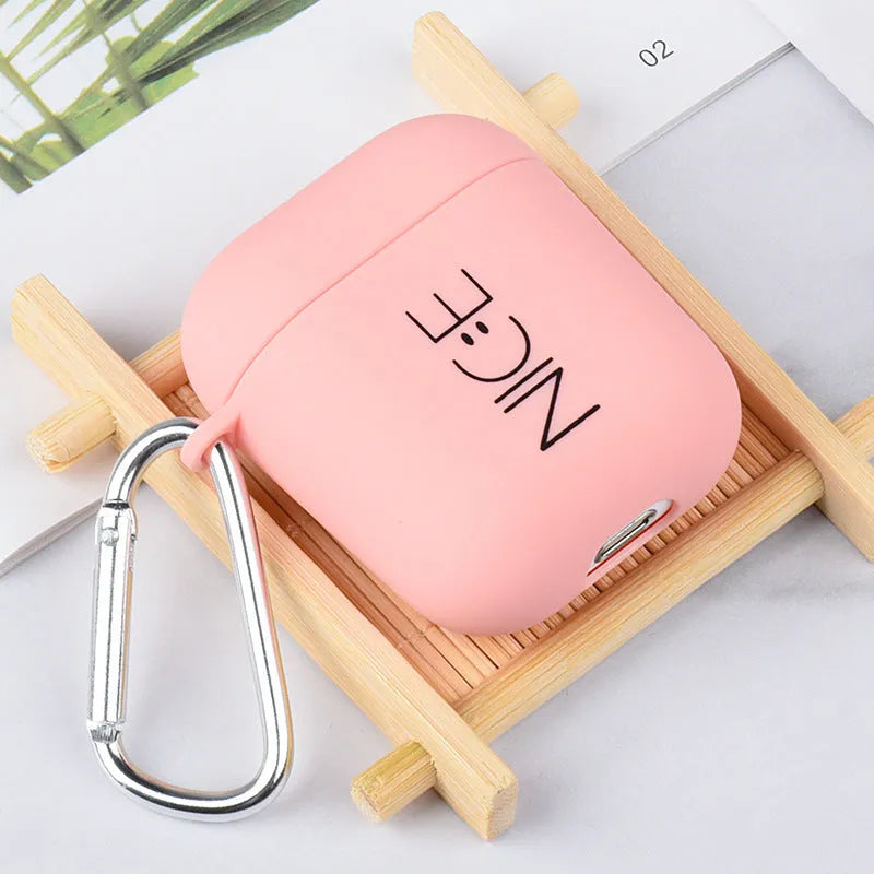 Black and pink AirPods case covers with flower, love heart, and smiley face designs