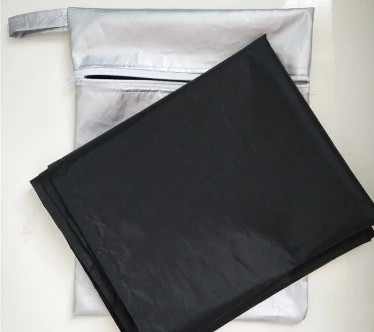 Magnetic car snow shield in black or silver, shown covering a car windscreen, available in 215x150x125cm and 245x180x145cm.