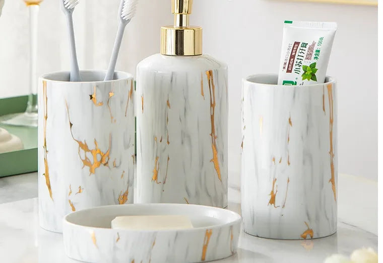 White ceramic bathroom wash kit with two cups, latex bottle and soap box in packaging