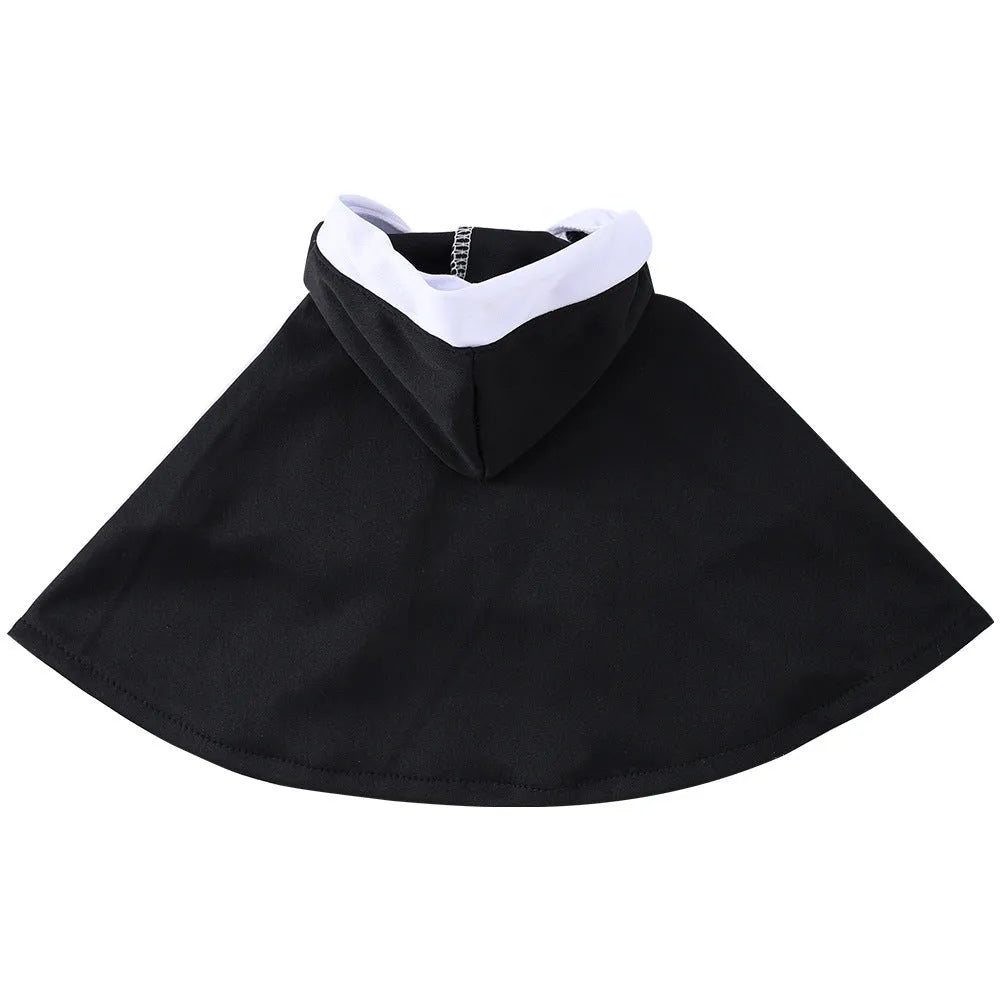 Cat wearing a black polyester nun cloak pet costume for Halloween with white collar