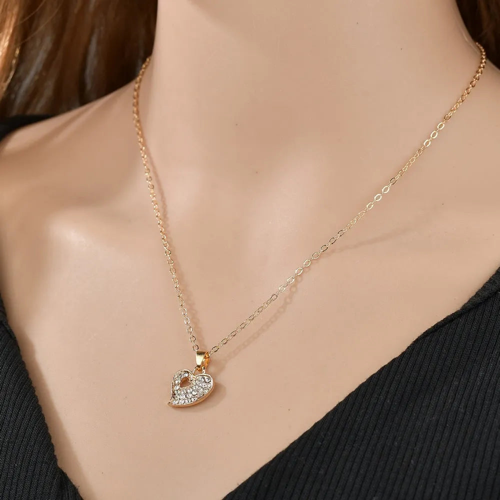 Women's gold electroplated alloy jewellery set with earrings, necklace and bracelet featuring Love, Water Drop and Bell patterns
