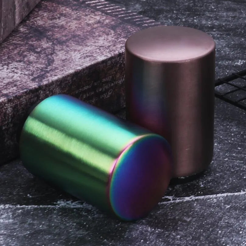 Portable magnetic stainless steel bottle opener with brushed metal finish on countertop