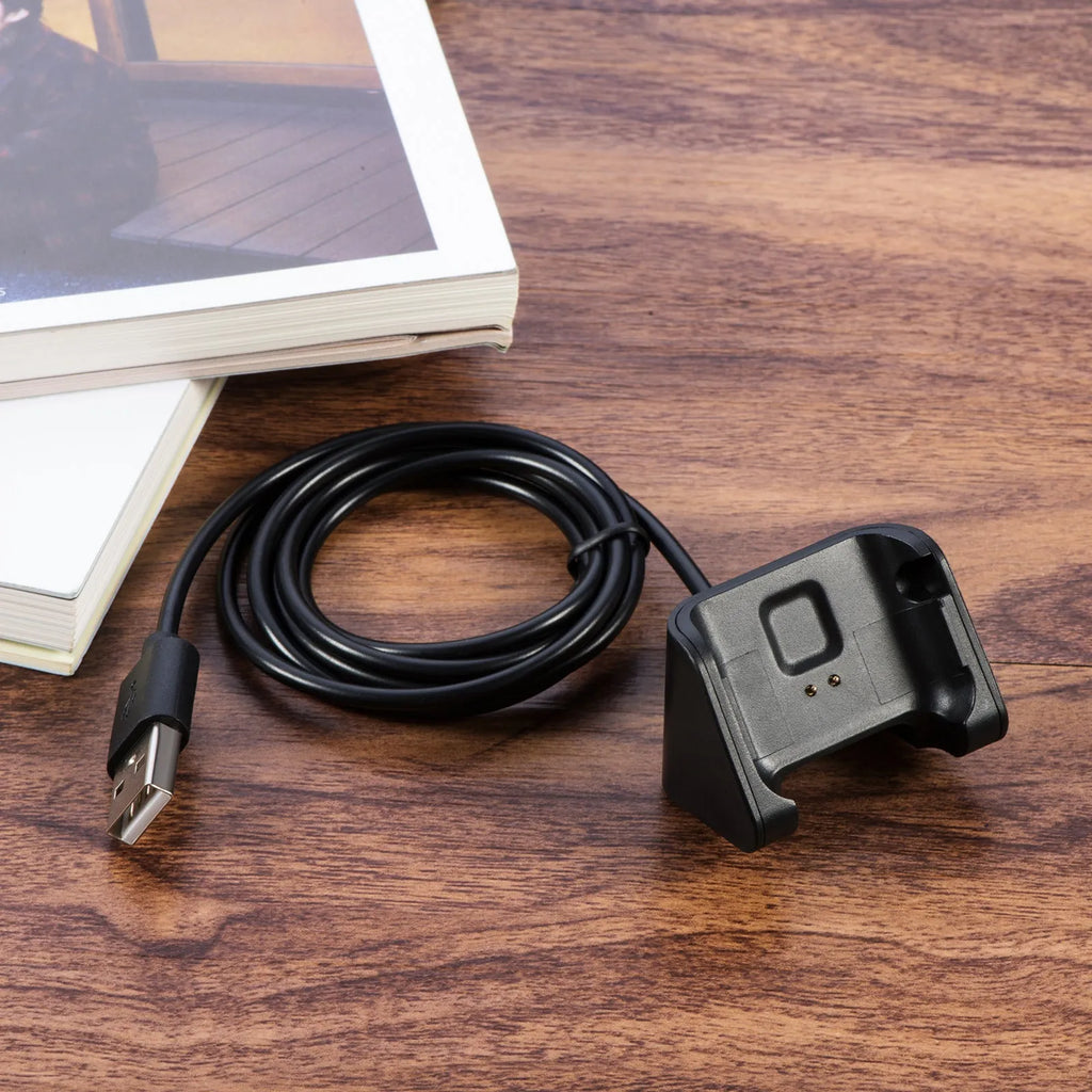 Black plastic charging cable for Youth Edition running smart watch, single replacement charger