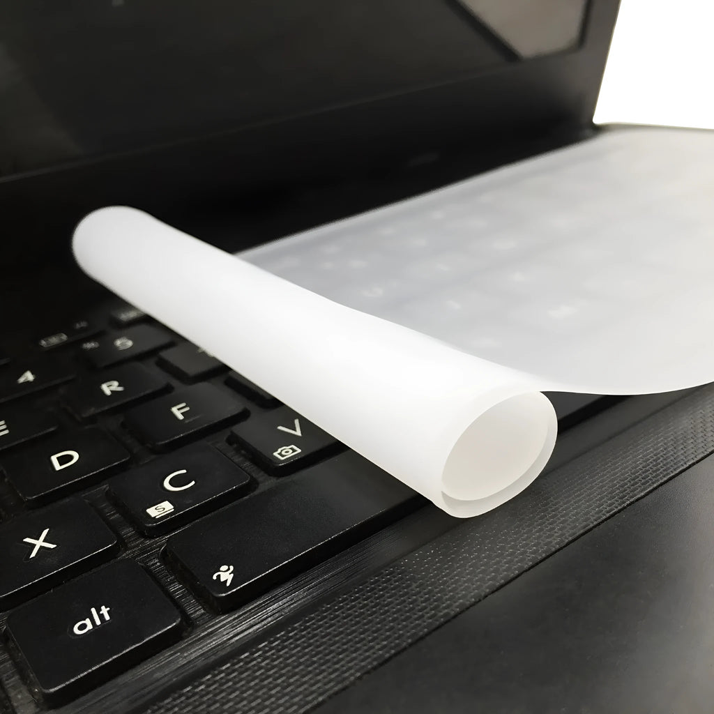 Transparent silicone keyboard dust film for 15 inch laptop showing close fit over keys