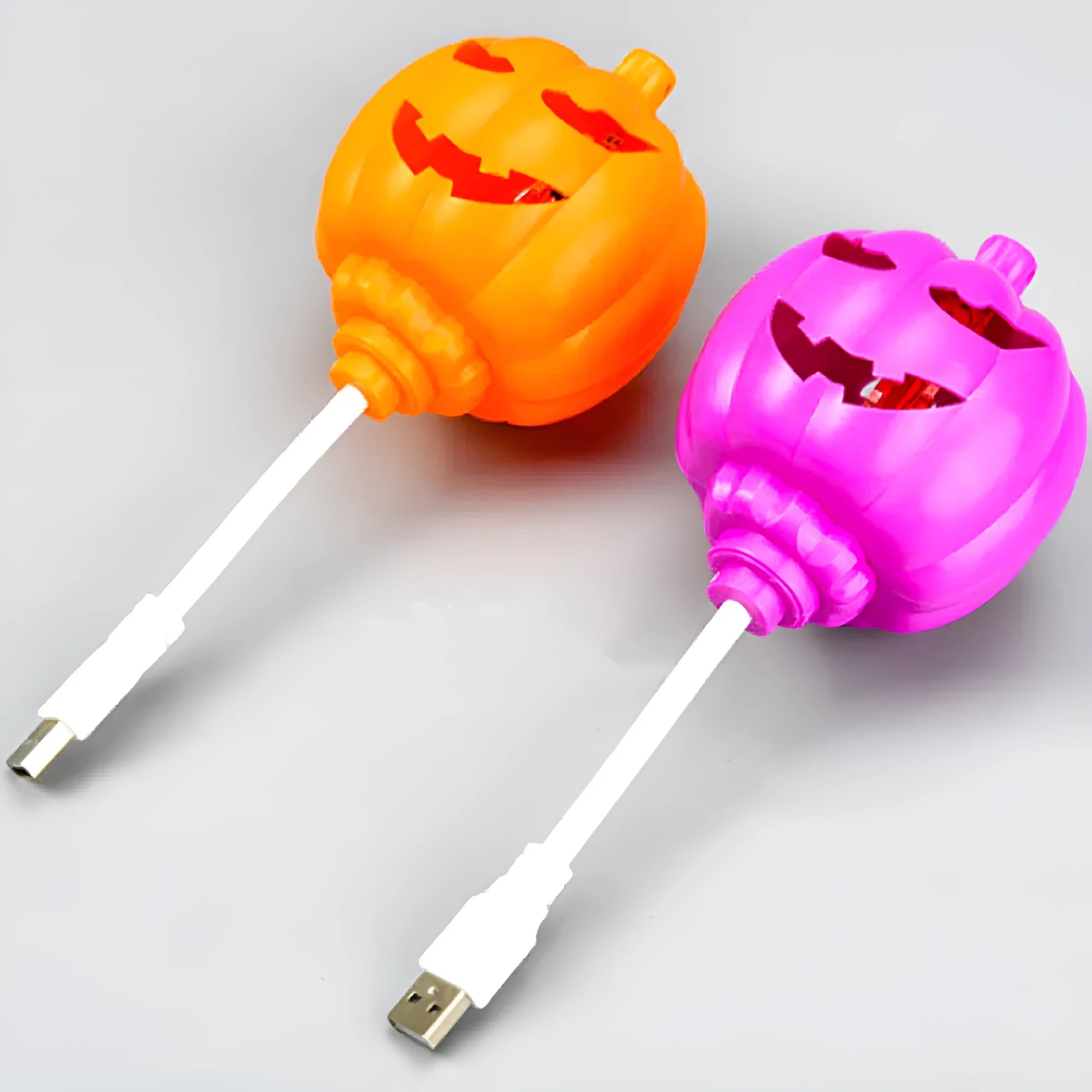 Plastic pumpkin decorative lamp with USB charging port and yellow or purple light options