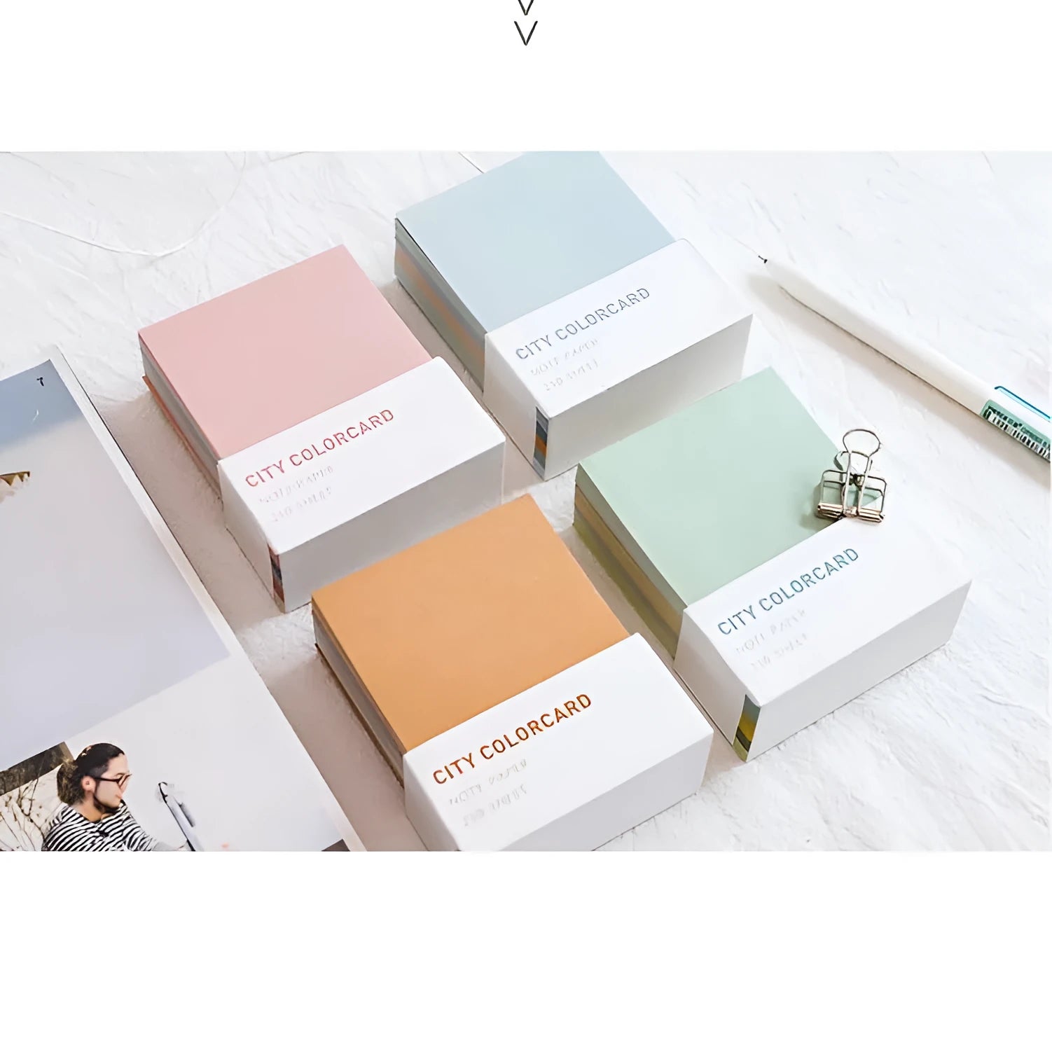Set of four rectangular 75x95mm paper memo notes with different cityscape designs, showing no adhesive backing.