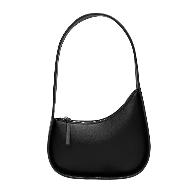 Half moon shaped leather ladies handbag with wide shoulder strap in small size