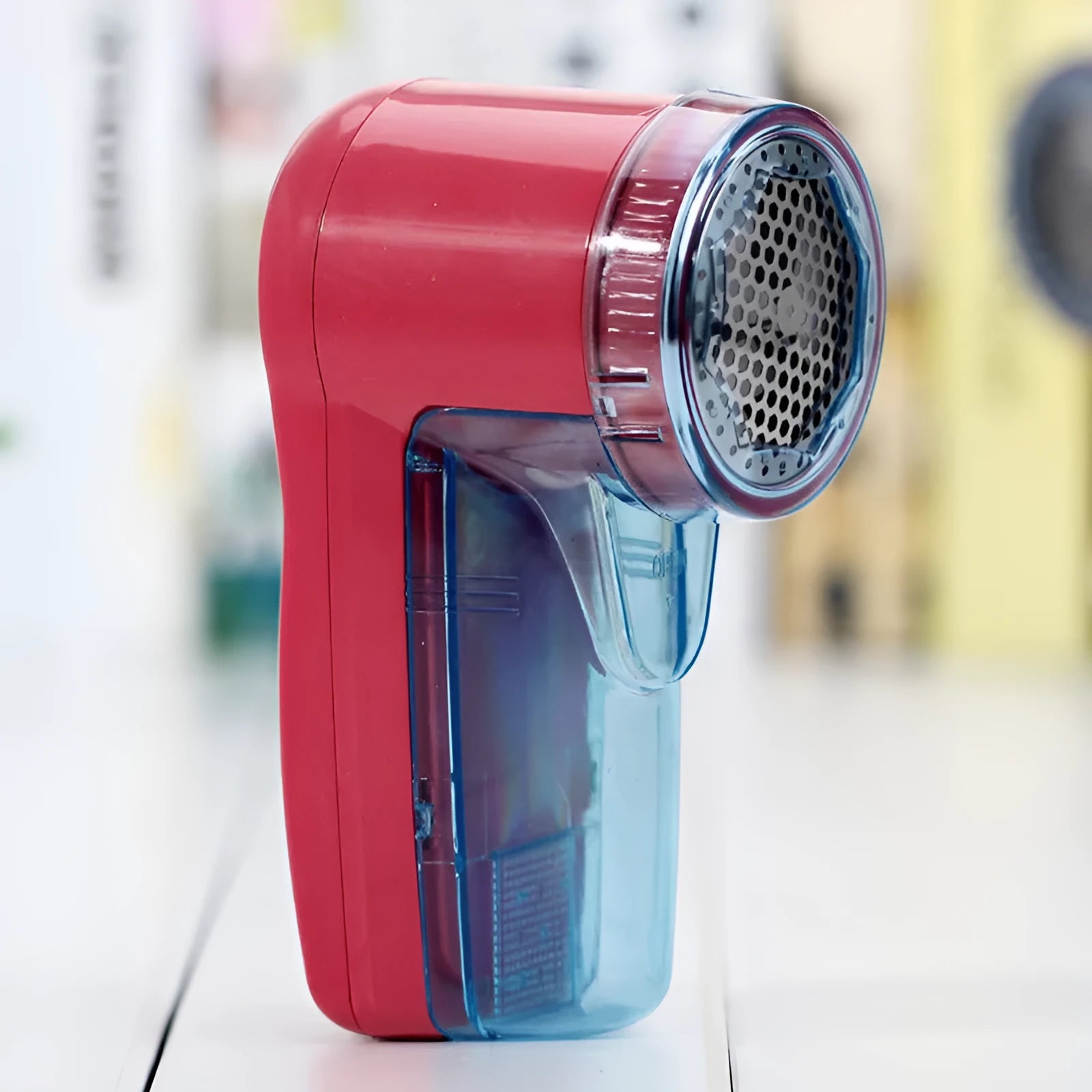 Portable electric lint remover with compact handheld design measuring 11cm for removing clothing pills