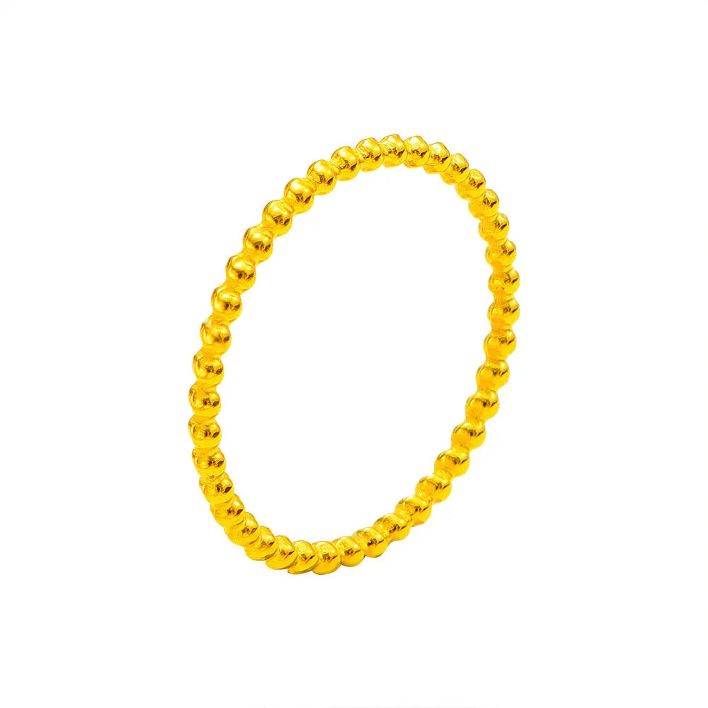 Titanium steel plain circle ring in gold finish on a neutral background
