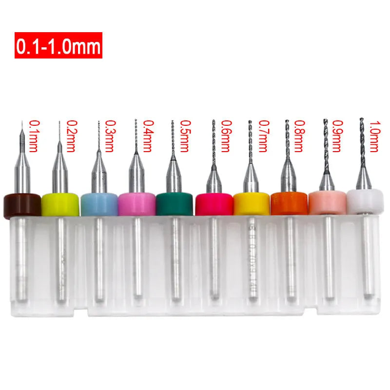 Ten small tungsten carbide circuit board drill bits with straight 3.2mm shanks on a white background.