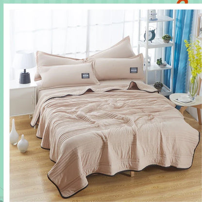 Lightweight, breathable cooling comforter in various colors and sizes for comfortable summer sleep