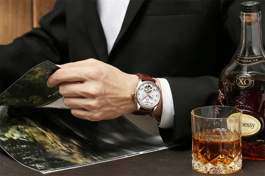 Men's automatic hollow tourbillon mechanical watch with 42mm dial and leather band on wrist