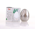 Stainless steel egg-shaped mechanical kitchen timer on a kitchen counter
