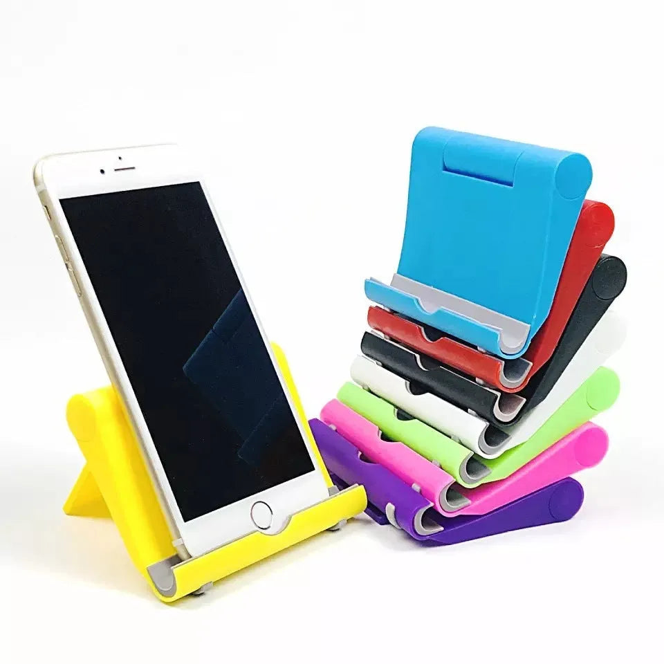Folding phone and tablet stand in PP and TPR, about 10cm by 8cm by 2cm, in eight colours