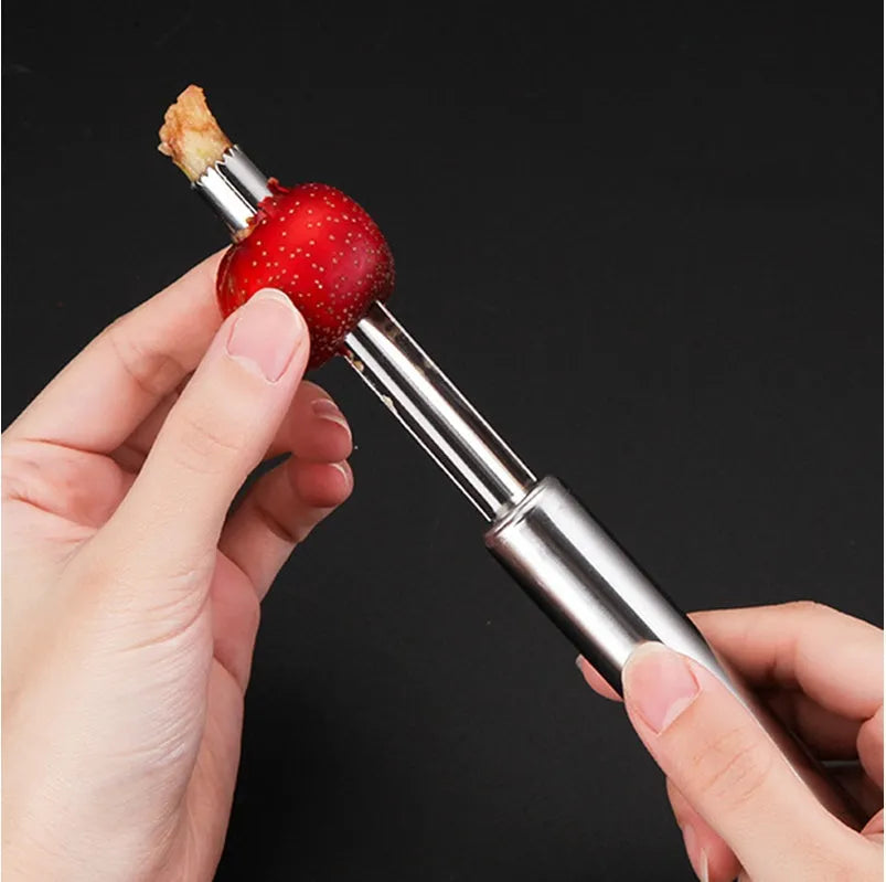 Stainless steel pineapple corer slicer with coloured ABS handle on kitchen counter