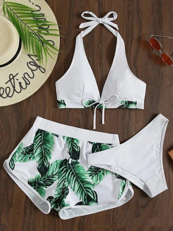 Stylish leaf print bikini with shorts in a variety of vibrant colors, perfect for summer beach or pool wear.