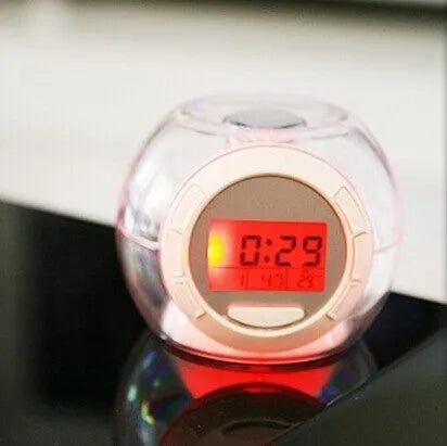 White colourful natural sound alarm clock with LCD display showing time and date