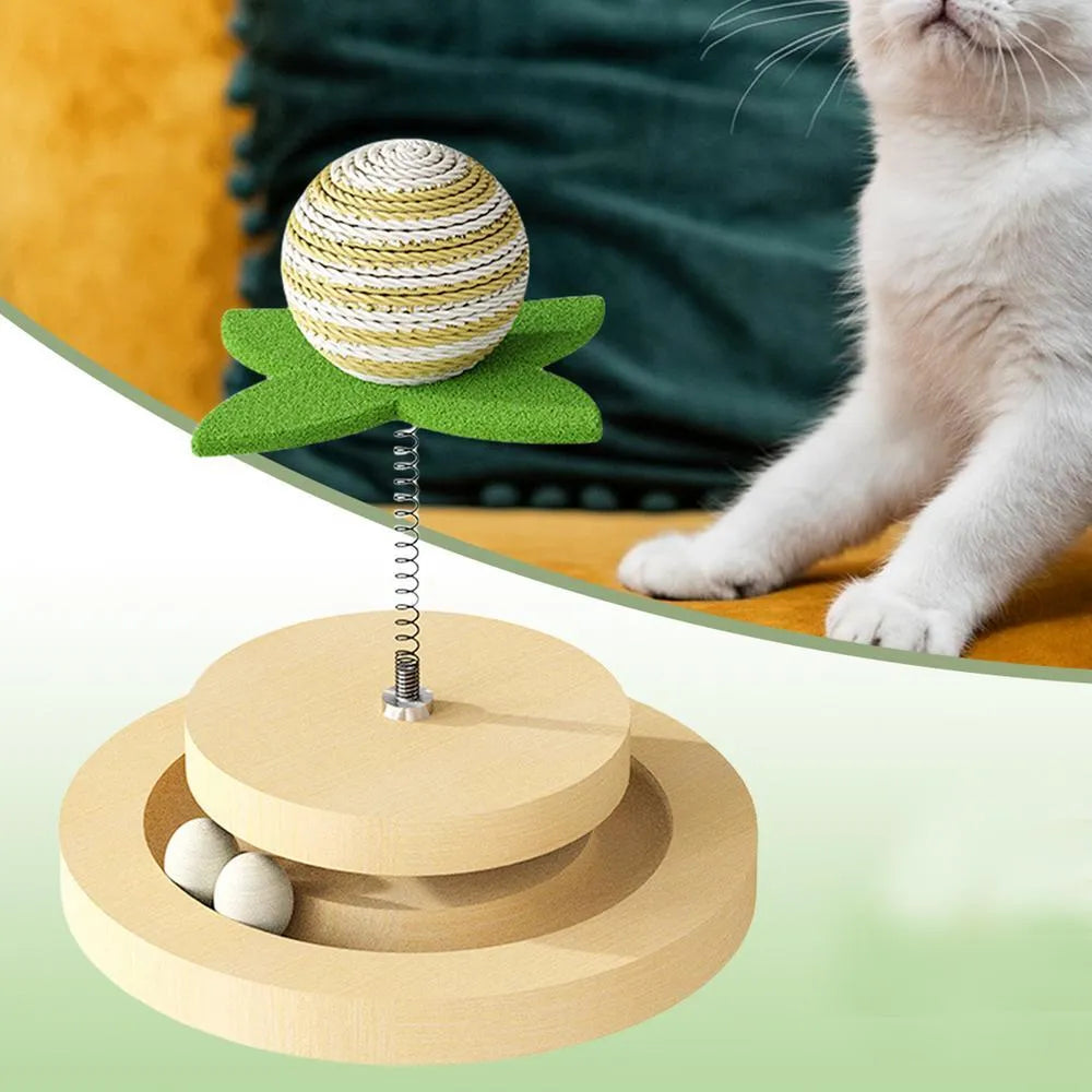 Green sisal cat toy with rotating ball track system for indoor feline play
