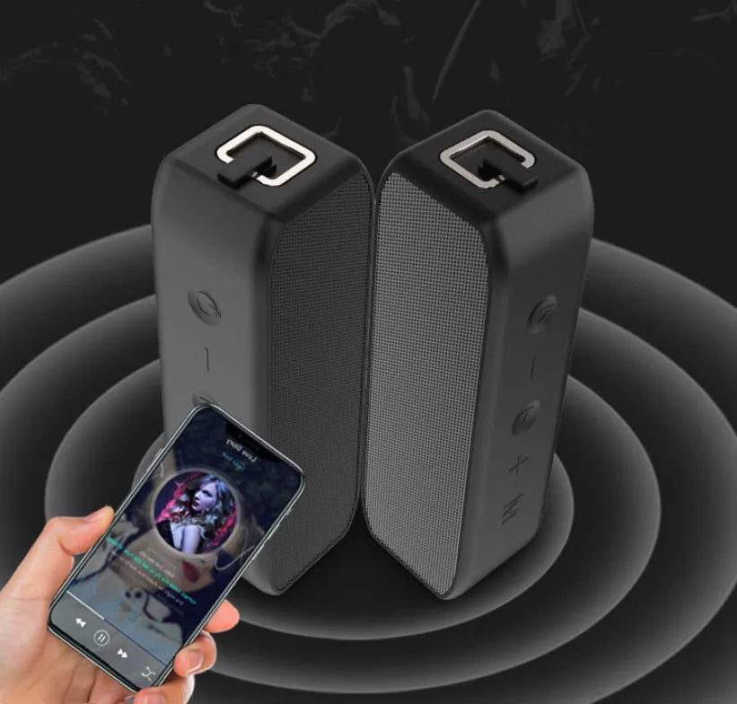 Black waterproof wireless Bluetooth speaker with button controls and USB port
