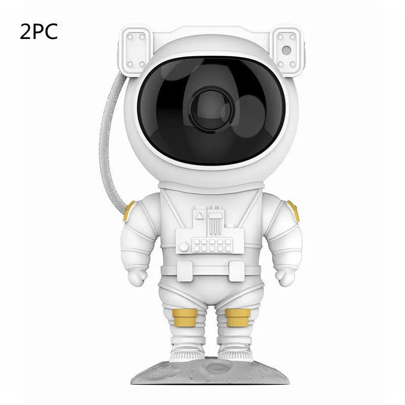 Creative astronaut galaxy starry sky projector nightlight on a table with nebula and star effects displayed against a dark background