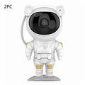Creative astronaut galaxy starry sky projector nightlight on a table with nebula and star effects displayed against a dark background