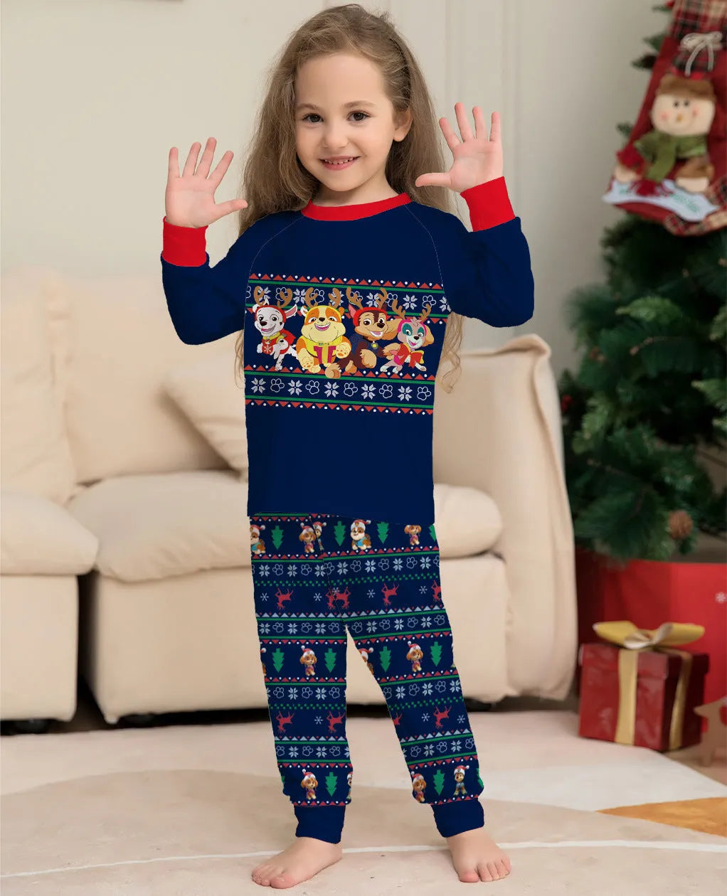 Matching red plaid Christmas pyjamas with cartoon deer print for men, women, children, babies, and dogs.