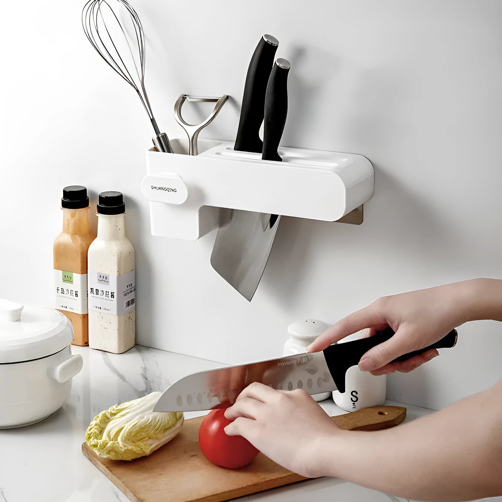 White plastic kitchen knife rack with modern simple design on a countertop