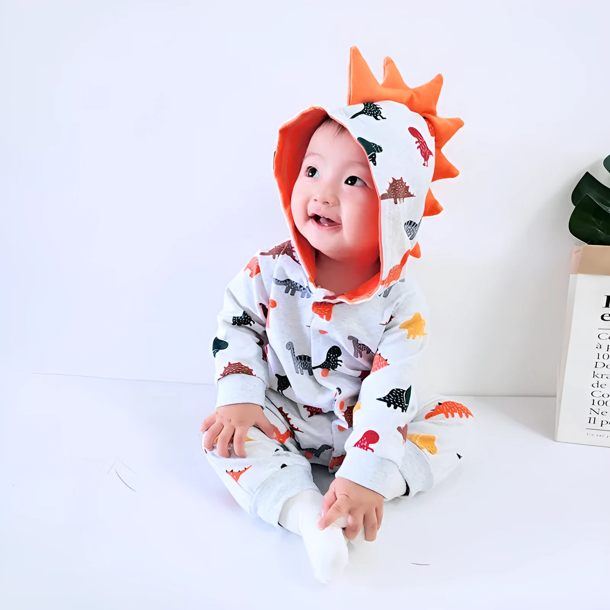 Dinosaur baby bodysuit in grey, blue, or pink with long sleeves, hood, and cotton fabric, Europe and America style