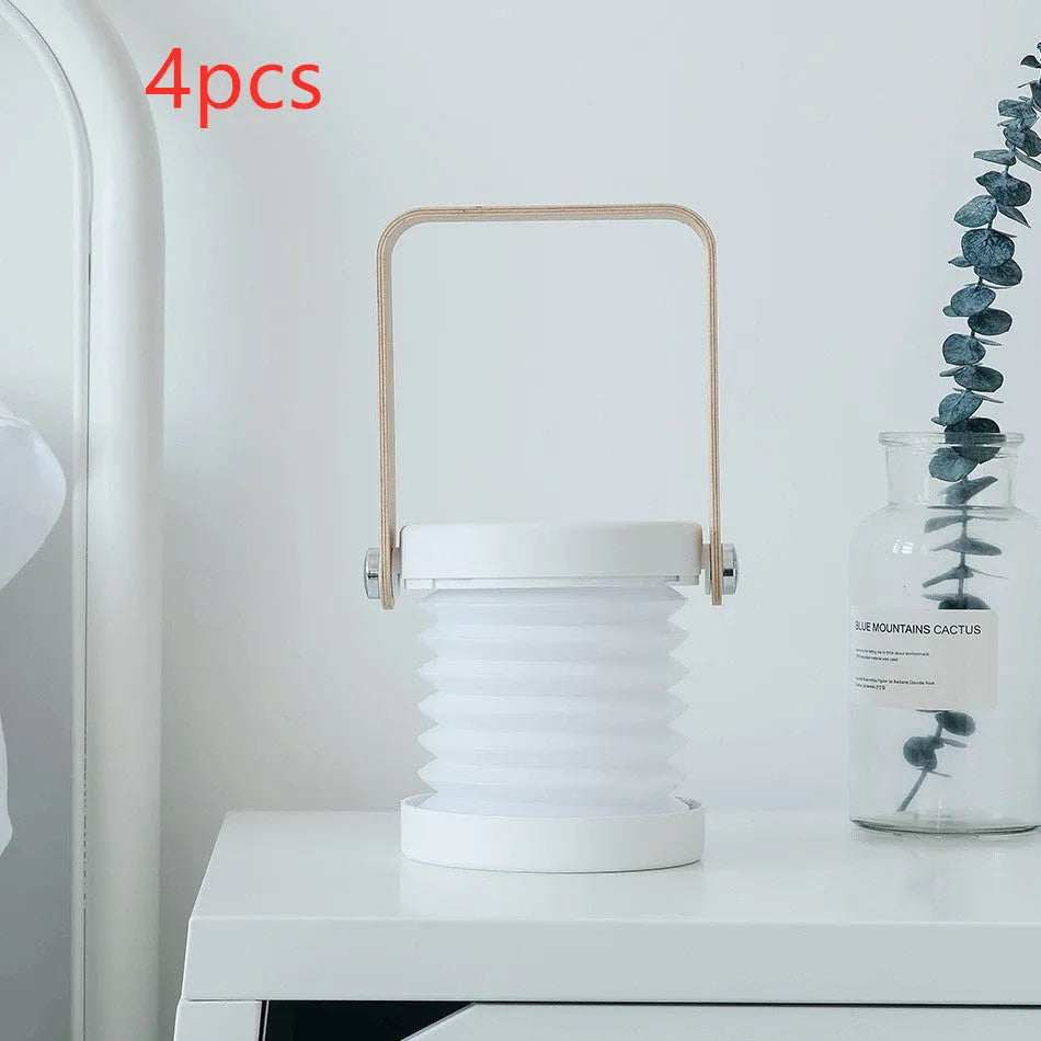 White foldable USB rechargeable LED lantern lamp shown in both table and upright night light modes.