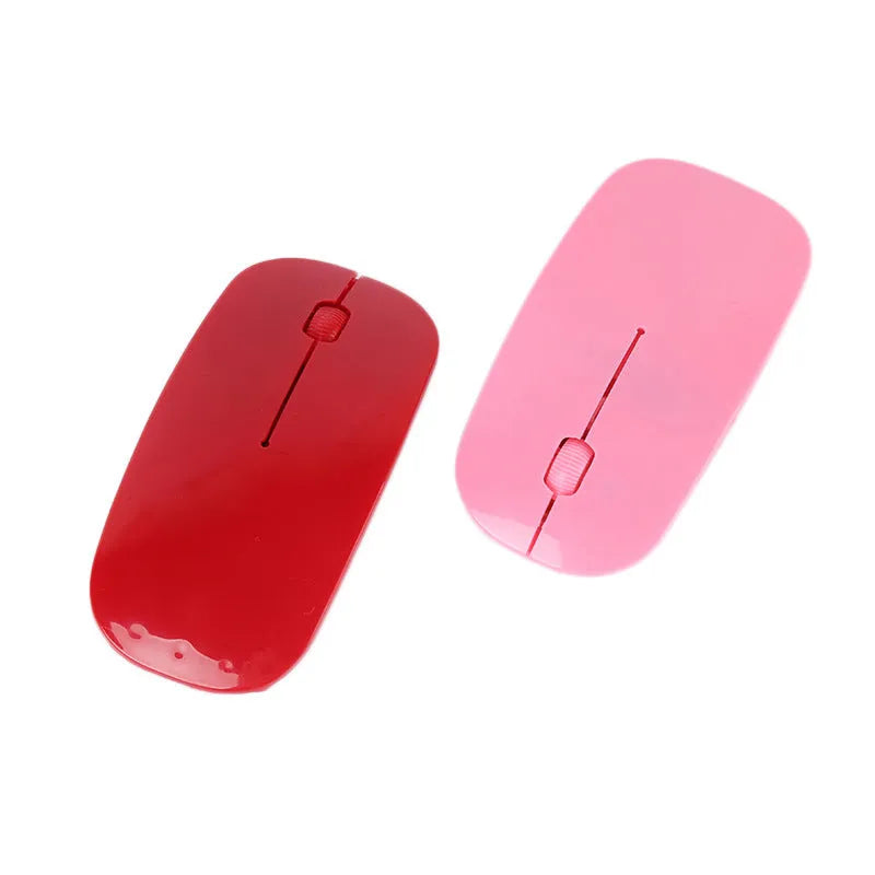 Wireless computer mouse with USB receiver available in seven colour choices on desk